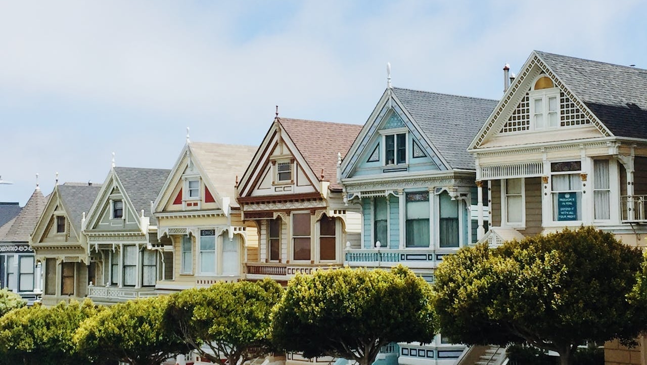 A row of colourful rental properties that were financed by DSCR lenders.