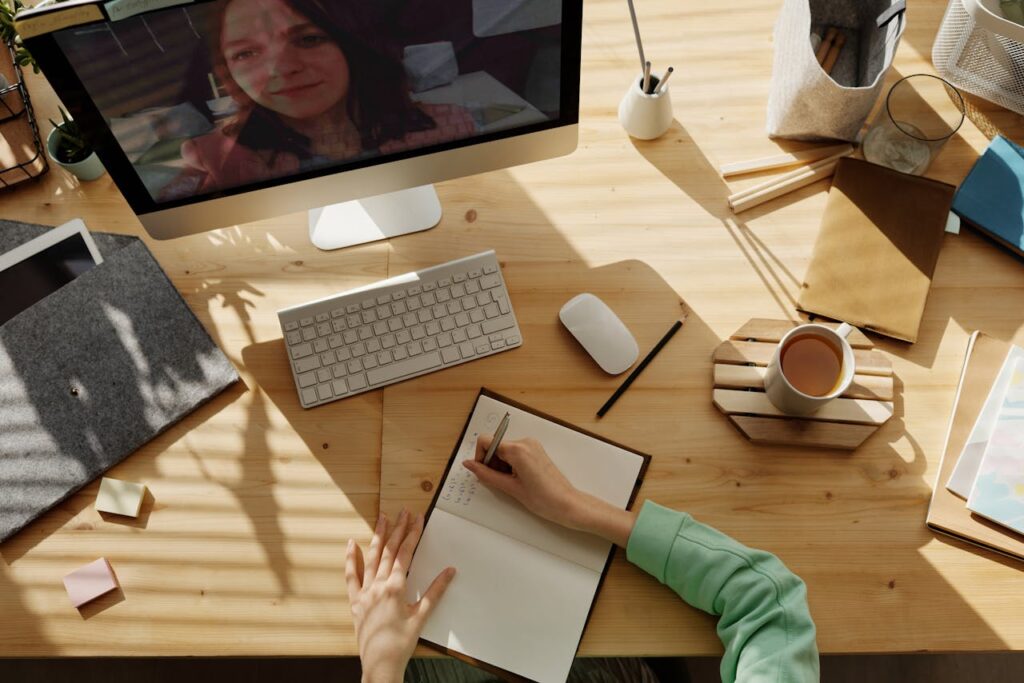 A self-employed individual, which is an ideal candidate for a portfolio loan, is taking notes during a meeting. 