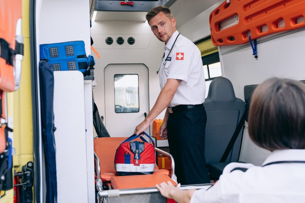 Two paramedics are in an ambulance discussing first responder home loans. 