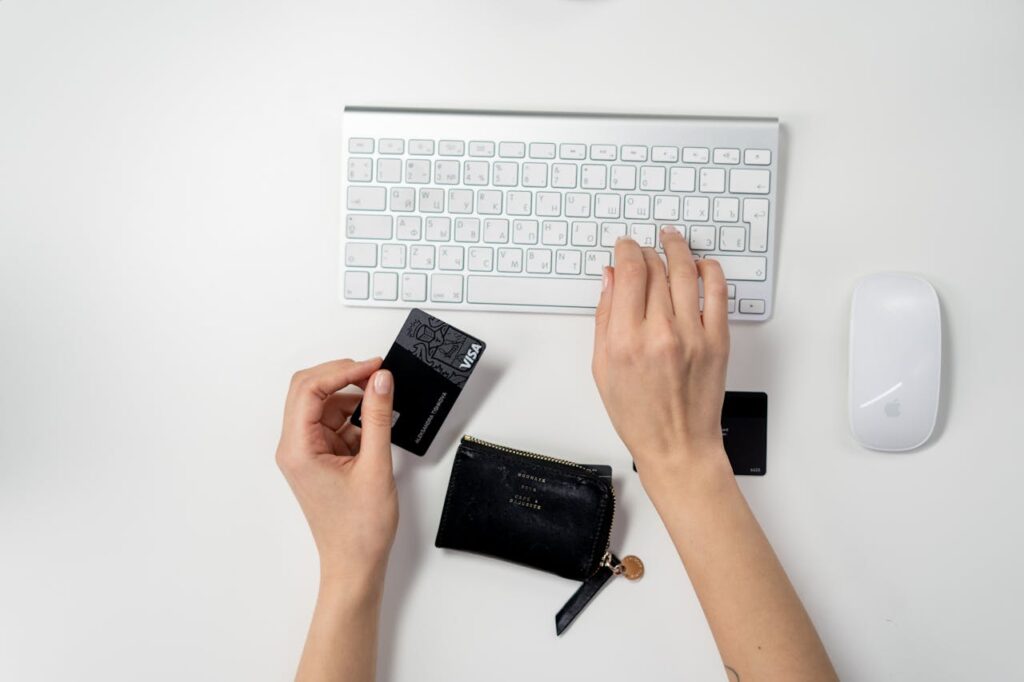 A woman is searching on her computer different ways she can improve her credit score.