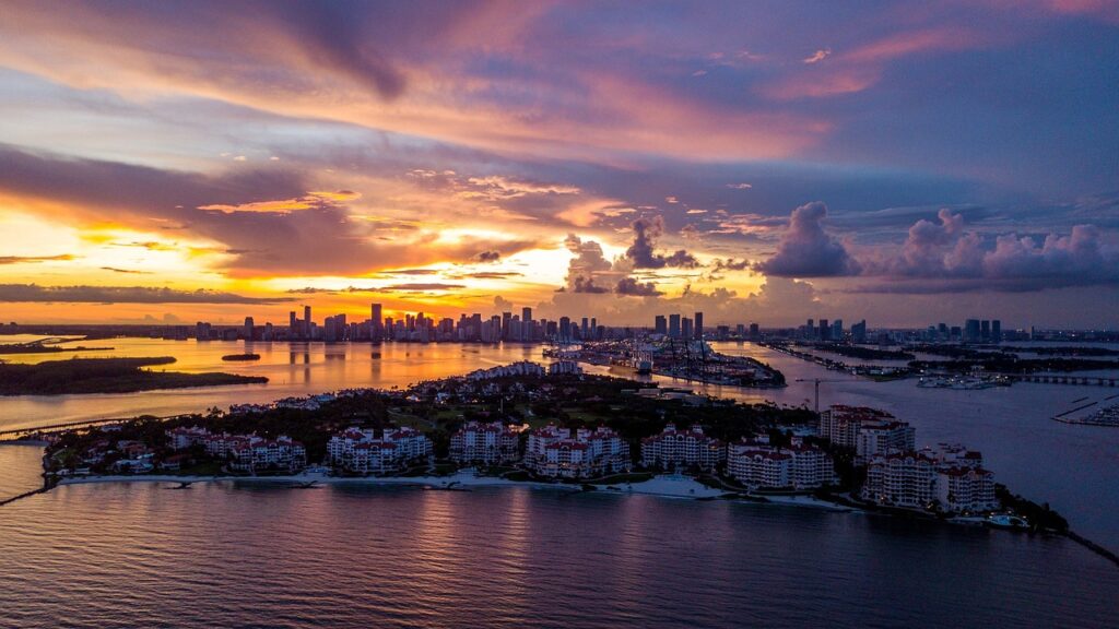 Sunset over Fisher Island in Florida, a great place to get a conventional loan Florida to finance a home.