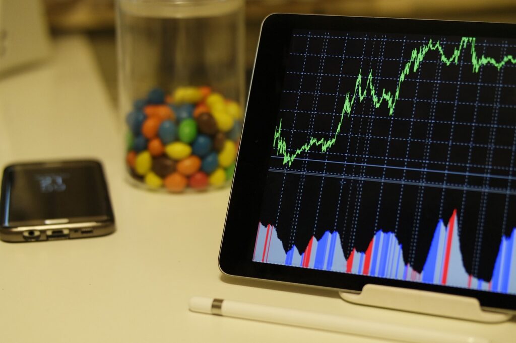 An iPad on a counter indicating DSCR loan New Hampshire interest rate fluctuations on a graph. 