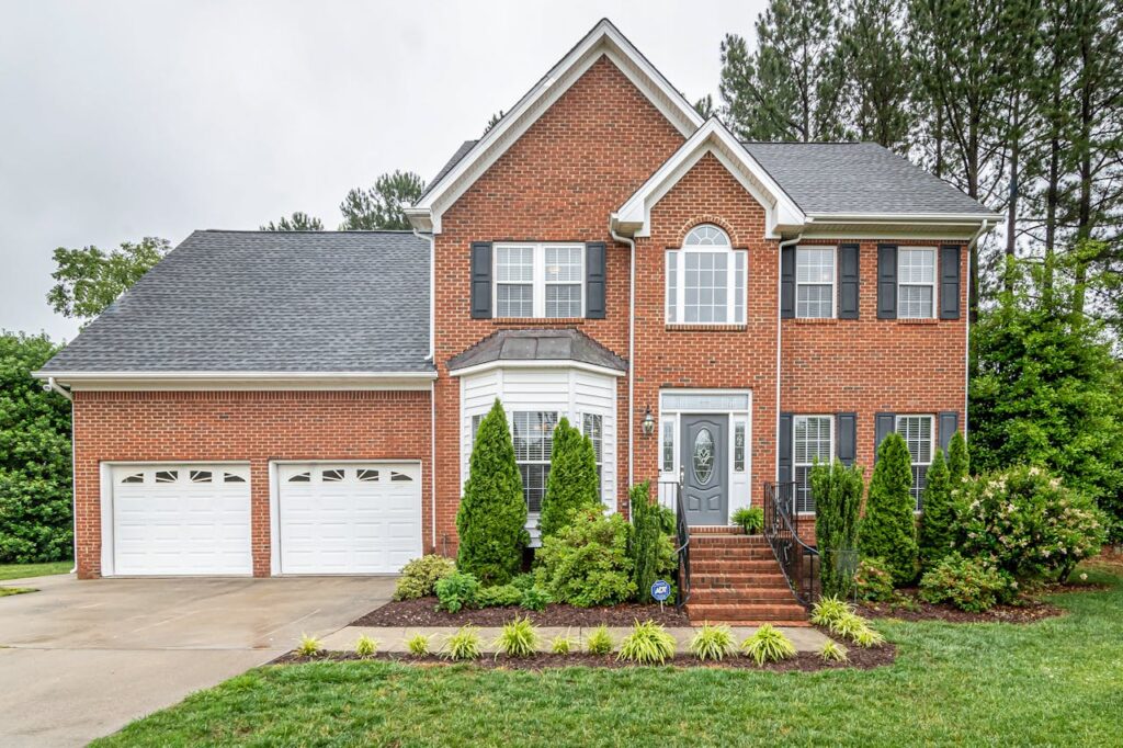 A red brick colonial home that was purchased after the Fed rate cuts. 